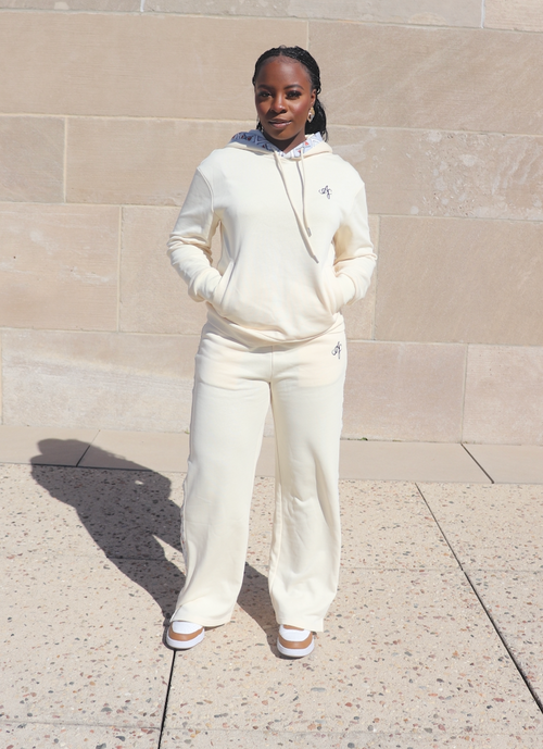 Cream loungewear set for women with hoodie and wide-leg sweatpants featuring subtle logo detail – Atielah Fashion