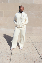 Cream loungewear set for women with hoodie and wide-leg sweatpants featuring subtle logo detail – Atielah Fashion
